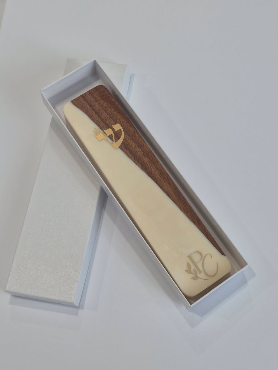 Walnut and ivory resin mezuzah case with a gold shin and PC monogram, in a white gift box